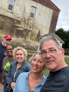 Rick and Kay in front of building